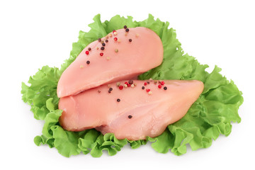 Fresh chicken fillet with lettuce isolated on white background with clipping path and full depth of field.