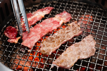 Sliced beef on a grill stove