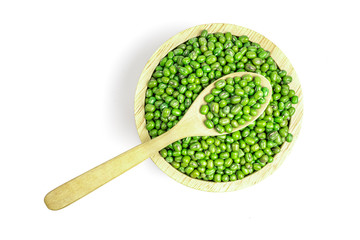 Top view, mung bean seeds in a bowl with a wooden spoon to scoop isolated on white background