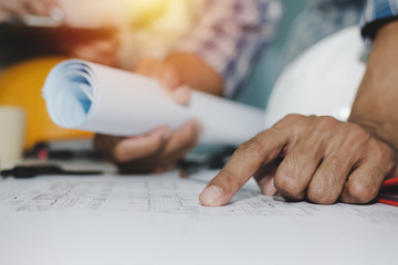 close up of a female hand holding a blueprint