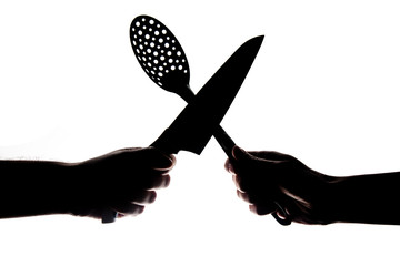 silhouettes of hands are holding kitchen tools. Male hand holds knife and female hand holds skimmer. Isolated on white.