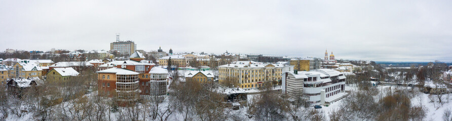 Fototapeta na wymiar Panorama of the Kirov city and and Razderikhinsky ravine in the central part of the city of Kirov on a winter day from above. Russia from the drone.