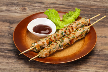 Minced pork skewer kebab with sauce