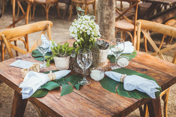 wedding ceremony reception table with glasses and cutleries