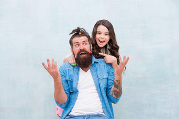 Going crazy being locked down in quarantine. Family leisure concept. Quarantine with children. Happy family. Happy childhood. Upbringing happy daughter. Daughter playing with hair. Girl dad hairdo