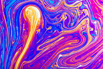 Colorful reflections on the surface of a soap bubble.