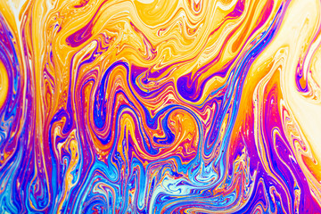 Colorful reflections on the surface of a soap bubble.