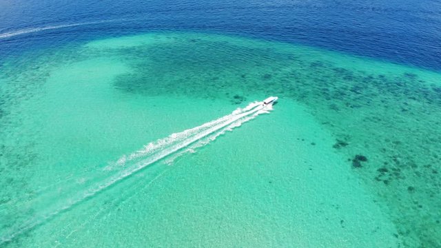 Boat speeding on the oceans of Kota Kinabalu, Malaysia