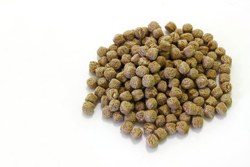 A bunch of crispy rye bran on a white background. Healthy food - a source of dietary fiber