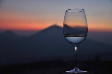 the Euganean hills at sunset time in winter with a glass
