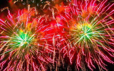 Colorful fireworks of various colors over night sky