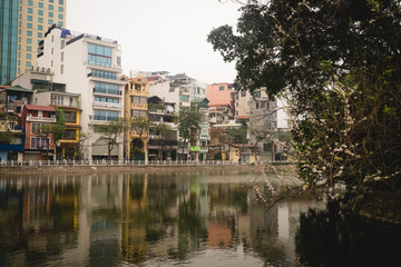 Fototapeta na wymiar Traditional vietnamese houses and reflection in Hanoi, Vietnam