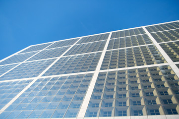 Windows of possibilities. Skyscraper modern city architecture. Modern building architecture. Sky reflects in mirror glass windows. Architecture concept. Business centre. Abstract background