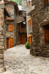 Fototapeta na wymiar narrow street in old town of Queralps