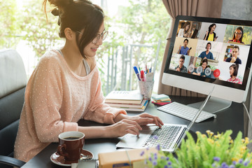 Asian woman work from home during corona virus, COVID-19 out break use laptop for teleconference with her teamates - Powered by Adobe