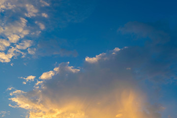 Fototapeta na wymiar blue sky with golden orange cloud sunset