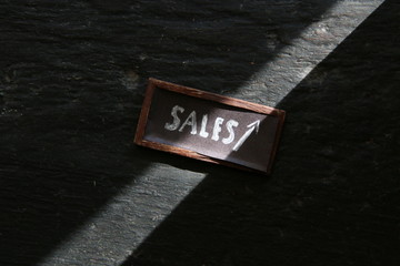 Sales growth idea, tag on a vintage table.