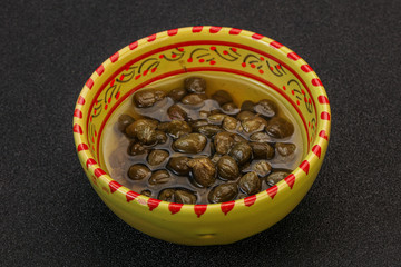 Tasty capers in the bowl