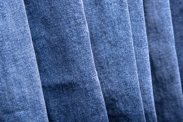 Naklejka premium back pocket of denim trousers. with ripped denim jeans close up for pregnant women