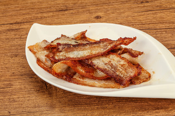 Roasted juicy bacon in the plate