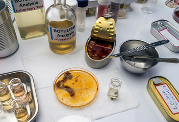  Several samples of tin cans, botulism infection in sick people, conceptual image