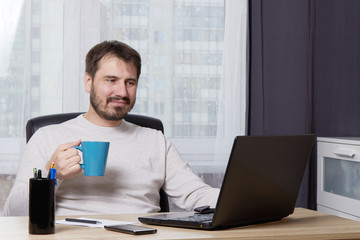 a man looking for work online unemployment concept