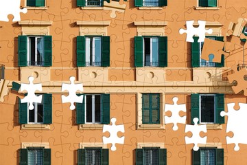 Assorted jigsaw puzzle of part of the facade of an orange Italian building with windows with green shutters
