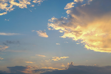 blue sky with golden orange cloud sunset