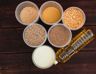 Various cereals and a bottle of sunflower oil. Raw porridge, food supplies in the kitchen.