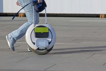 people go with an electric monowheel to the shopping center © justoomm
