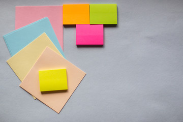 Colored sticky notes on a light background. The view from the top. Space for text. Horizontal...