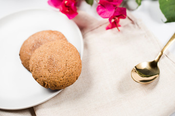 Delicious homemade cookies, served at home. Bright and colorful colors. Flower on top.