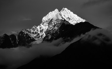 Black and white image of Thamserku mountain peak in Everest Region of Nepal. Black and white...