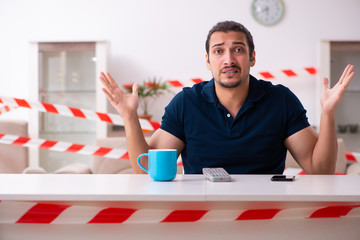 Young man at home in self-isolation concept
