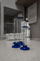 Pharmacy tubes standing on the counter in the pharmacy where you need to measure out doses of medicines