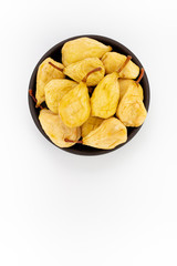 Dried Pears in round bowl on white background, top view