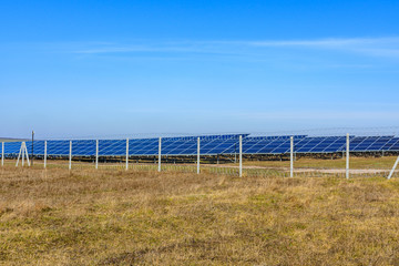 Many solar panels in a field. Clean energy. Ecological concept