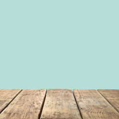 Empty wooden surface on mint background. Mockup for design