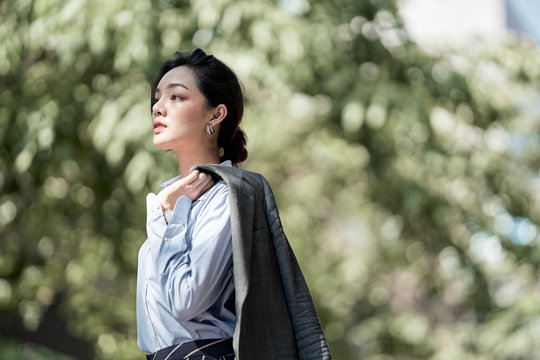 A beautiful Asian business woman is looking forward for her future.