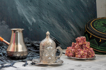 Oriental sweets Turkish delight and carved cup