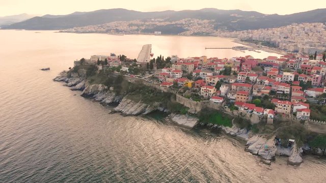 Aerial point of interest shot of Kavala Greece old town Panagia gulf in 4K