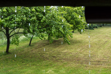 Raindrops falling  from the roof, rainy day concept