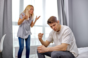 portrait of young caucasian woman chastising husband for his antics, bad behavior, unhealthy...
