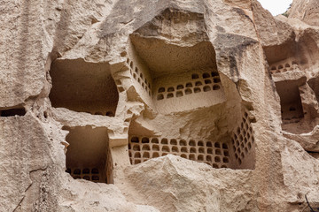 Cave in the rocks in the valley of Cappadocia. Close-up. Tourism and travel.