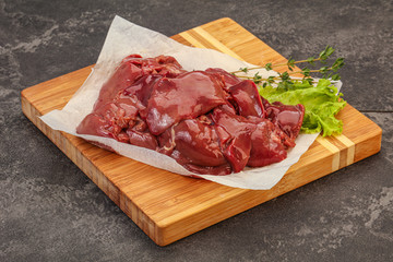 Raw chicken liver over board