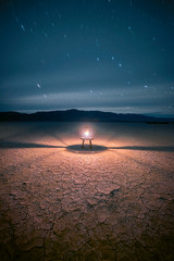 Oil lantern under a starlit sky in the desert