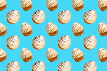 Seamless pattern of baking Cruffins on a blue background. muffins puff croissants trend 2020 . Wallpaper background pattern