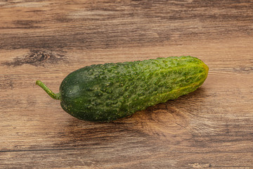 Green ripe fresh cucumber over background