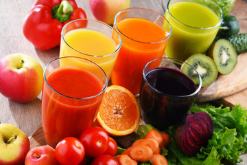 Glasses with fresh organic vegetable and fruit juices