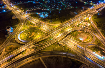 Fototapeta na wymiar Aerial view and top view of traffic on city streets in Bangkok , Thailand. Expressway with car lots. Beautiful roundabout road in the city center.